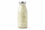 cucmber dill salad d ressing in aplain bottle
