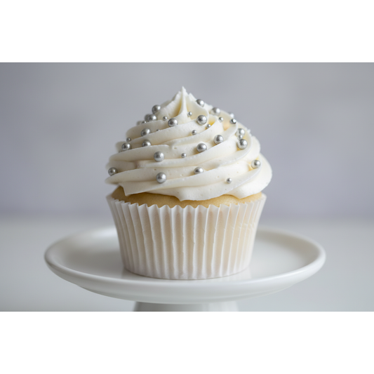 white cupcake with silver dragees on it